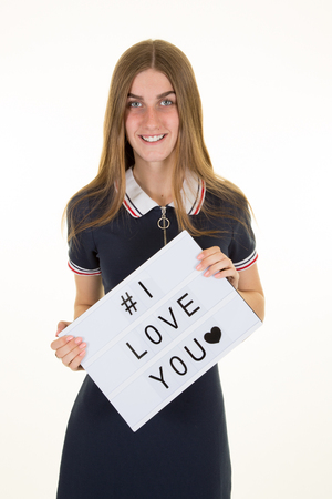 pretty girl with board sign i love you for mother or boyfriendの写真素材