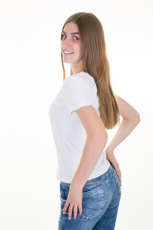 beauty slim young woman in jeans and totaly empty white shirtの写真素材