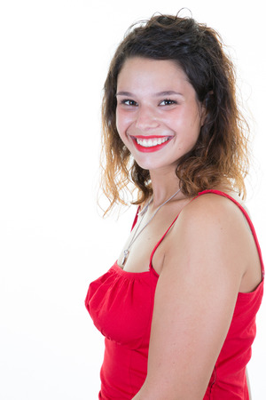 Beautiful happy woman smiling over a white backgroundの写真素材