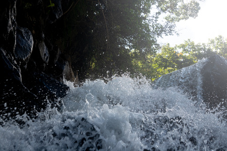 Detail of water from waterfall in summer background