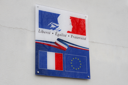 french sign with france and europe flag and marked liberte egalite fraternite means in french freedom equality fraternityの写真素材