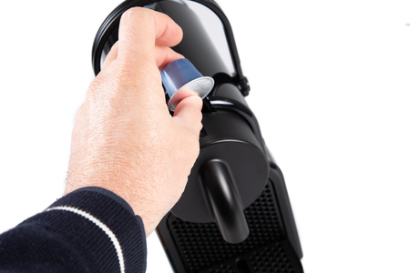 Espresso maker machine capsule coffee with hand manの写真素材