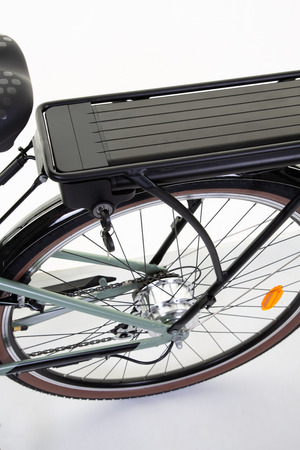 Close up of battery pack of a modern electric bicycle isolated on white backgroundの写真素材