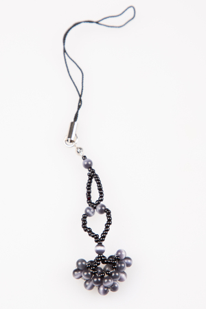 homemade jewerly necklace by black pearl beads on white backgroundの写真素材