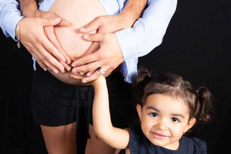 beauty pretty young girl with belly pregnant mother in loveの写真素材