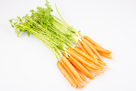 Fresh organic carrot vegetable with green leaves Healthy food isolated on white backgroundの写真素材