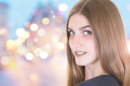 cute pretty face woman blonde in night cityの写真素材