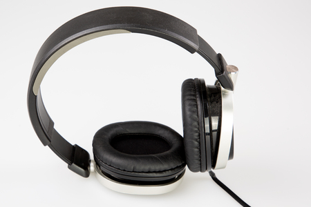 audio black headphones dj in white studio backgroundの写真素材