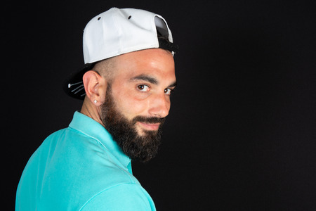 Saudi arabian muslim guy portrait on black background