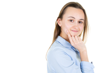 young woman with finger on her chin thinking in white background in headshot portrait and copy space