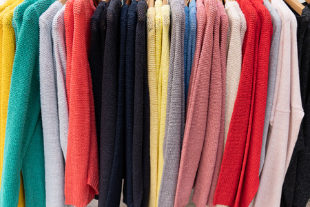 Different clothes on the rack in store for backgroundの写真素材