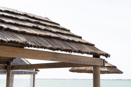 Beach bar thatched roof tavern cafe near the seaの写真素材