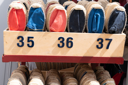 Colorful handmade rope soled sandals espadrilles in market streetの写真素材