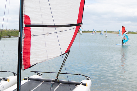 sailing club learning sailing boat and sailboards windsurfの写真素材