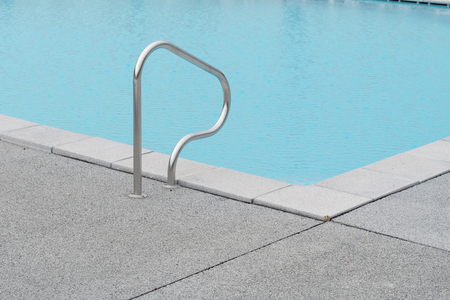 Ladder steel of corner blue swimming poolの写真素材