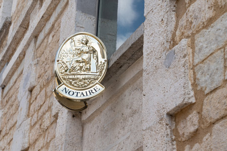 French notaire sign on wall above entrance to the notary officeのeditorial素材