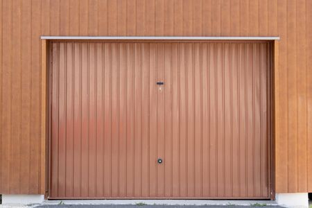 Brown metal closed shutter door of modern garageの写真素材