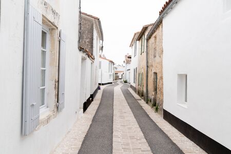 Alley and old white Houses in st martin de re franceの写真素材