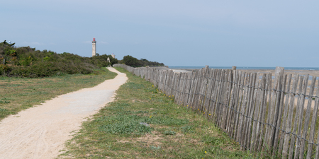 walk path alley view of Baleines lighthouse in Ile de Re France in web banner templateの写真素材