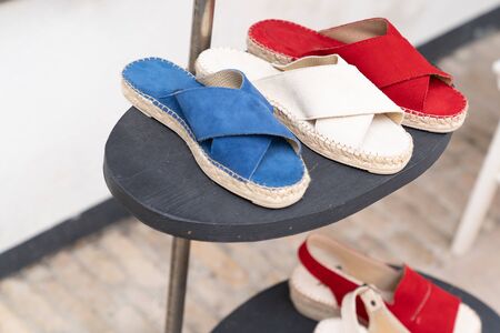 woman shoes modern colorful french white red blue espadrilles for sale in shop streetの写真素材