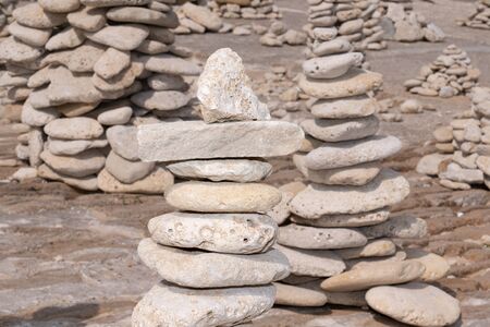 Isle de Re stones balance tower on beachの写真素材