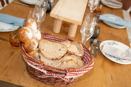 Bread in slices on wooden table