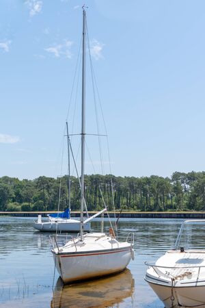 summer lake in Lacanau Gironde in France with sail boat