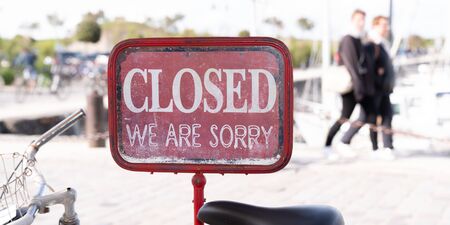 shop sign saying sorry we are closed on bike in Ile de Re France