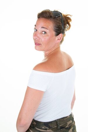 Friendly smiling portrait of attractive middle-aged woman isolated on white background