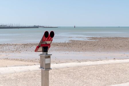 Sightseeing Binoculars telescope of tourist on the Beachの写真素材