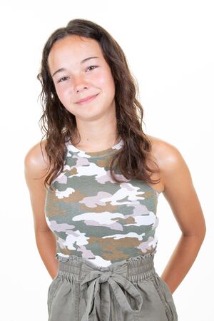 Portrait of beautiful fashion teen girl smiling isolated on white backgroundの写真素材