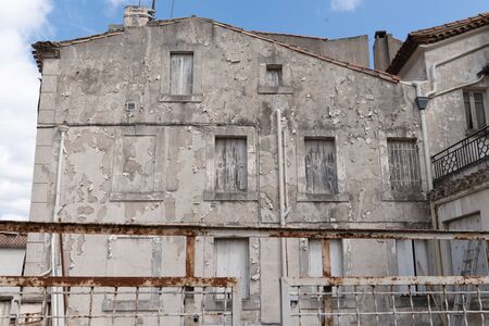 old town house with worn and old-fashioned paint