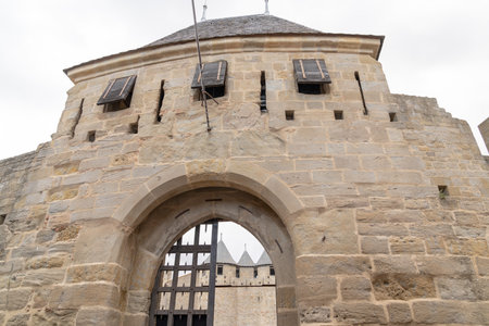 entrance of the ancient medieval castle of the fortress of Carcassonne in Aude Franceのeditorial素材