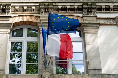 French and EU European Union flags fluttering on the city hall in Franceの写真素材