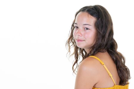 Young beautiful woman thinking teenager girl looking  aside at blank copy space isolated in white backgroundの写真素材