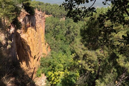 Picturesque red ocher cliffs in village of Roussillon Provence in Franceの写真素材