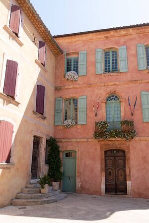 street place in the old town ocher colors of Roussillon Provence in Franceの写真素材