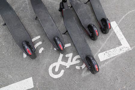 Modern Ñity transport electric e scooters parked on street cityの写真素材