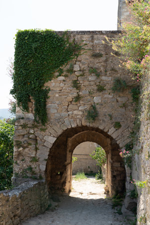 medieval arch stone in village of mÃ©nerbes in Luberon Franceのeditorial素材