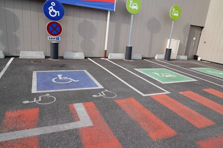 Handicapped parking car only electric vehicle ve pictogram on streetの写真素材