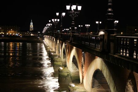 bordeaux pont de pierre old stony bridge at nightの写真素材
