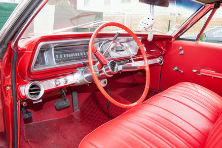 Bordeaux , Aquitaine / France - 11 07 2019 : Chevrolet Impala red interior dashboard steering wheel instruments in Classic historic luxury car in perfect conditionのeditorial素材