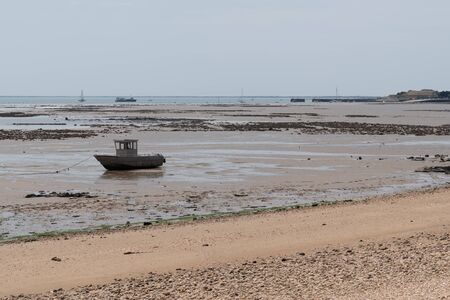 low tide boat on sand in beach Oyster Parks Countryside of Ile d'Aix in France