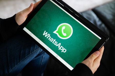 Bordeaux , Aquitaine / France - 11 25 2019 : Whatsapp logo sign on tablet screen at home couchのeditorial素材