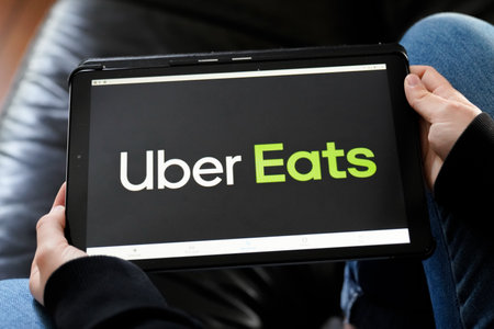 Bordeaux , Aquitaine / France - 11 25 2019 : Uber Eats sign logo tablet home application food...