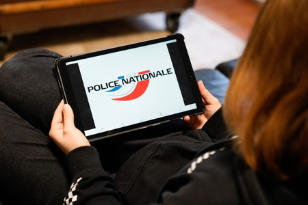 Bordeaux , Aquitaine / France - 11 30 2019 : police nationale sign logo french in screen tablet hands young woman Franceのeditorial素材