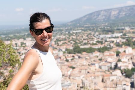 woman with sunglasses Overview of Cavaillon during trek vacation tourismの写真素材