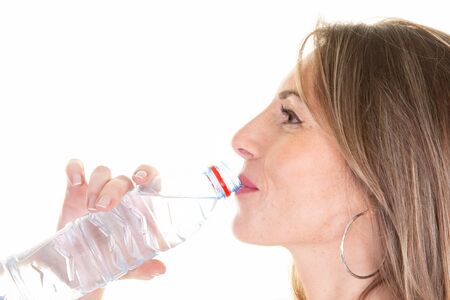 good looking girl water drinking during training in close up side view
