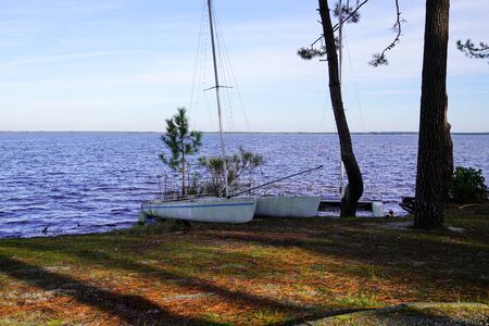 summer scene in lake in Gironde France in carcans village with boat