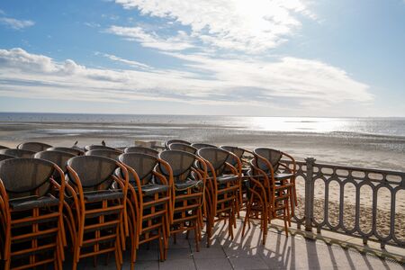 view sea beach Andernos-les-Bains in Arcachon bay cafe terrace seat in pontoon at low tideの写真素材